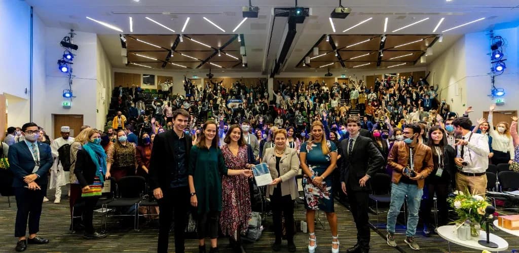 Youth delegates presenting the Global Youth Statement during a formal handover ceremony
