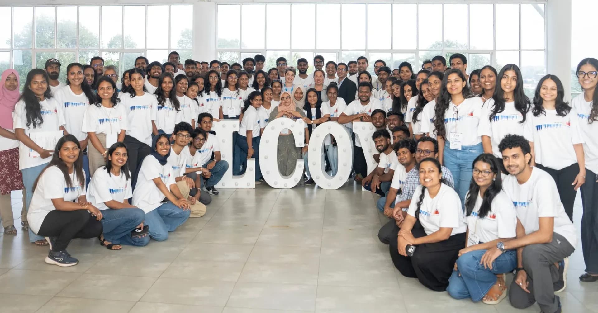 LCOY participants gathered around illuminated LCOY sign letters